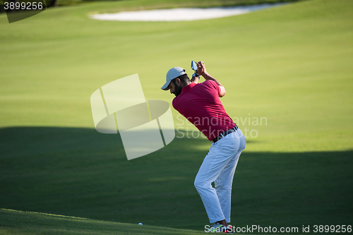 Image of golf player hitting long shot