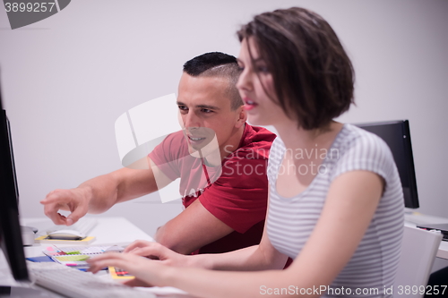 Image of technology students group working  in computer lab school  class