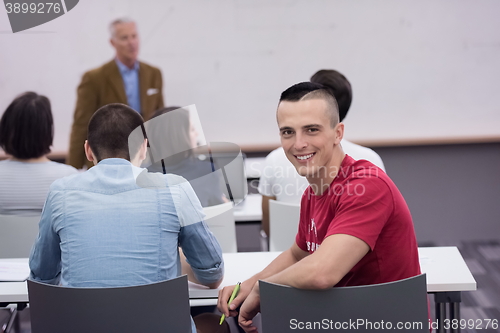 Image of technology students group in computer lab school  classroom