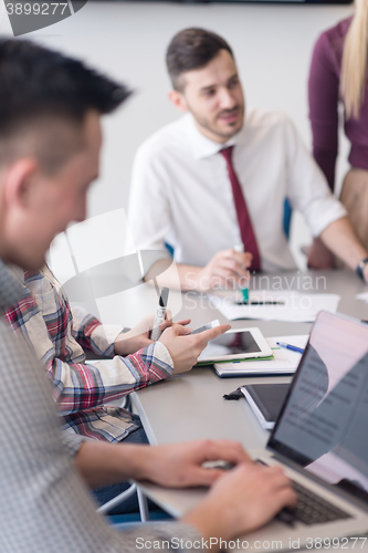 Image of young business people group on meeting at modern office