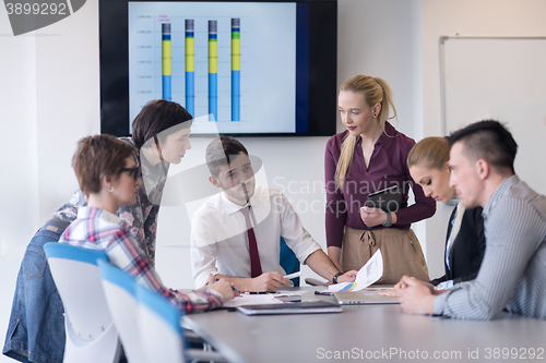 Image of young business people group on meeting at modern office