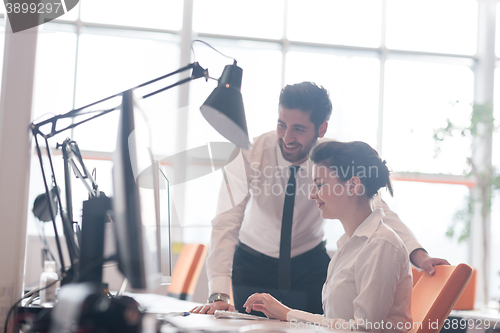 Image of business couple working together on project