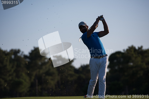 Image of golfer hitting long shot