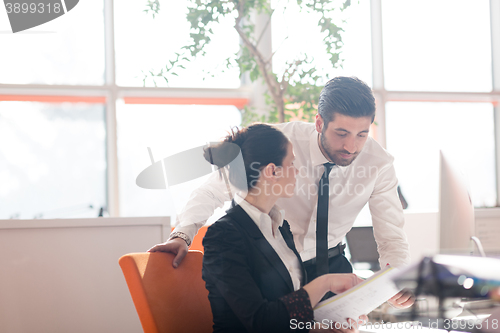 Image of business couple working together on project