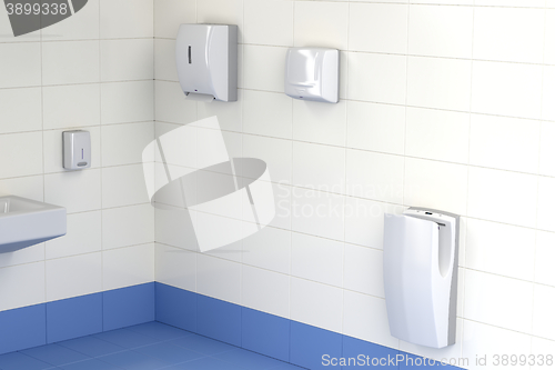 Image of Three different types of hand dryers in the toilet