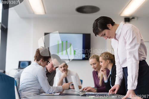 Image of young  woman using  tablet on business meeting