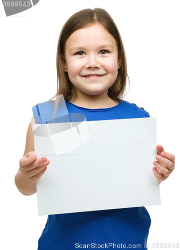 Image of Little girl is holding blank banner