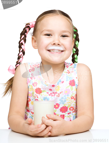 Image of Cute little girl showing milk moustache