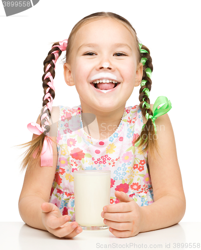 Image of Cute little girl showing milk moustache