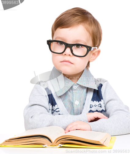 Image of Little child play with book