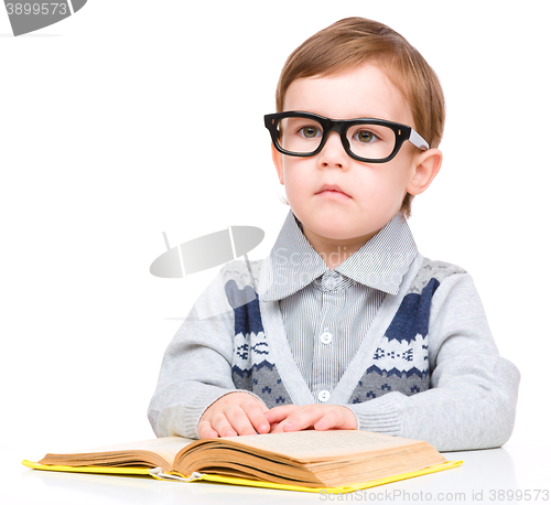 Image of Little child play with book