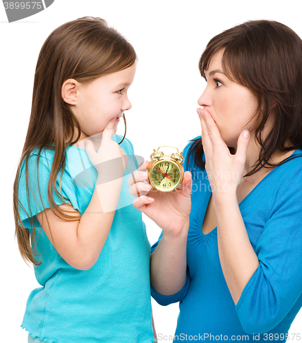 Image of Little girl and her mother are anxious about time