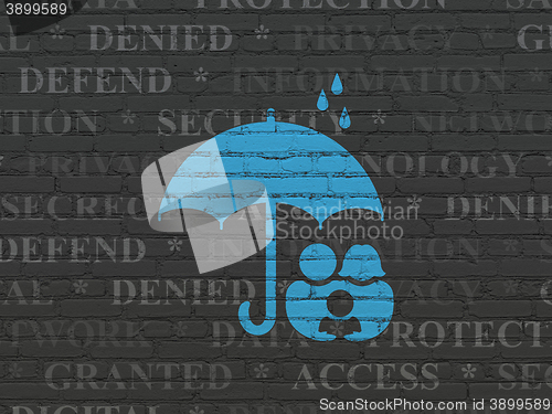 Image of Protection concept: Family And Umbrella on wall background
