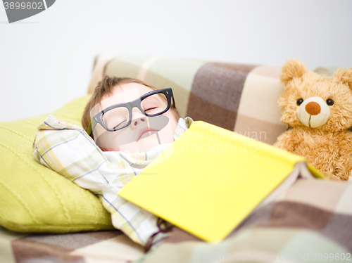 Image of Cute little boy is sleeping