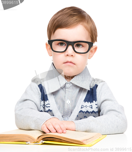 Image of Little child play with book