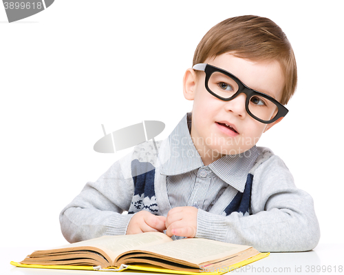 Image of Little child play with book