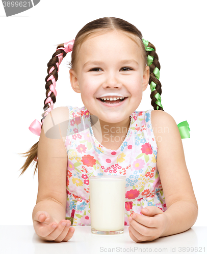 Image of Cute little girl showing milk moustache