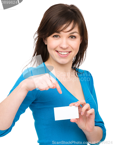 Image of Young woman is holding visit card