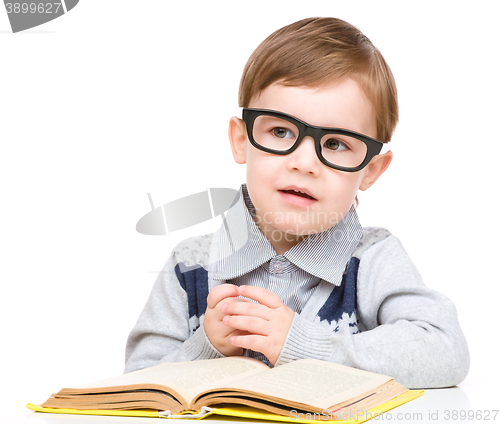 Image of Little child play with book