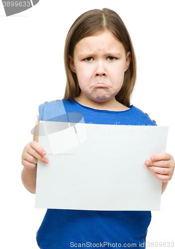 Image of Little girl is holding blank banner