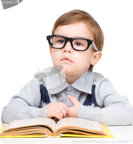 Image of Little child play with book