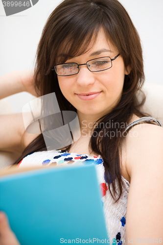 Image of Woman is reading a book