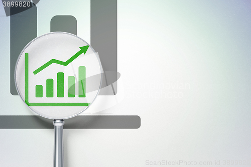 Image of Marketing concept:  Growth Graph with optical glass on digital background