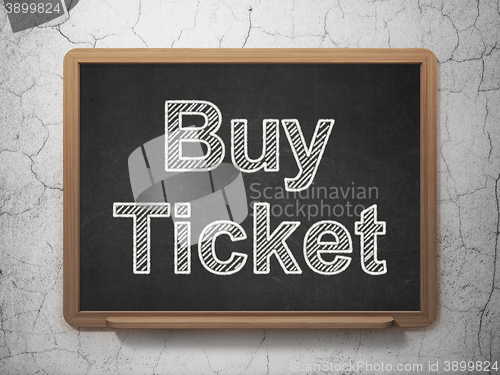 Image of Vacation concept: Buy Ticket on chalkboard background