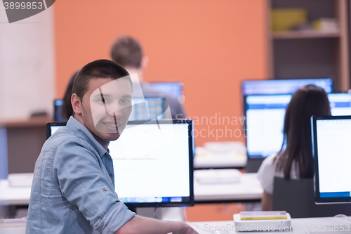 Image of technology students group working in computer lab school  classr