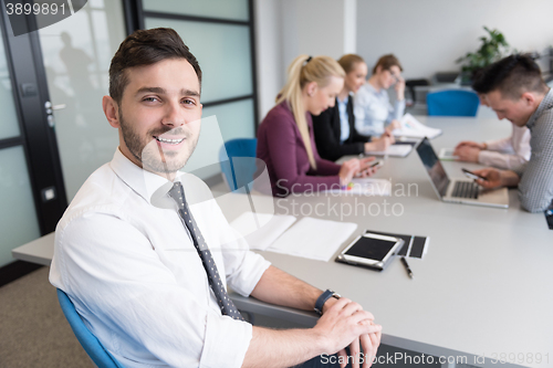 Image of young business people group on team meeting at modern office