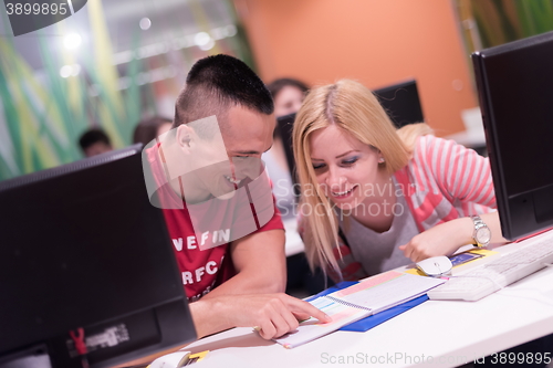 Image of technology students group working  in computer lab school  class