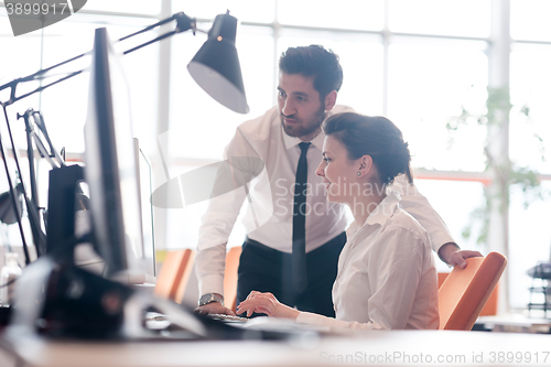 Image of business couple working together on project