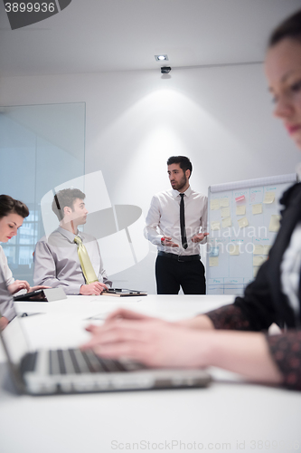 Image of young business woman on meeting  using laptop computer