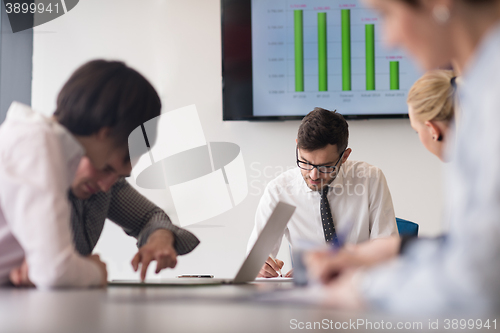 Image of young business people group on team meeting at modern office