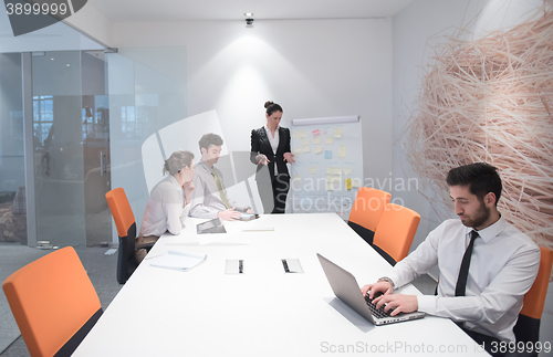 Image of young business man at meeting