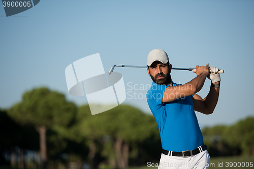 Image of pro golfer hitting a sand bunker shot