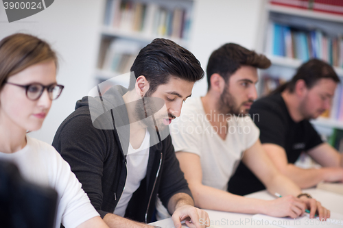 Image of group of students study together in classroom