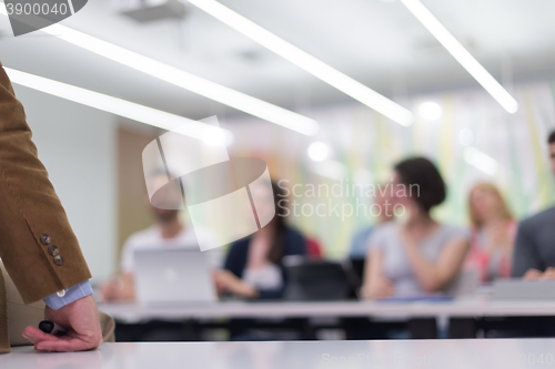 Image of close up of teacher hand while teaching in classroom