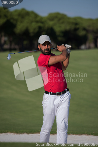 Image of golfer hitting a sand bunker shot