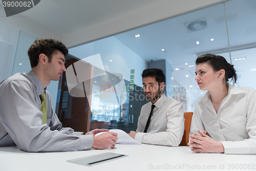 Image of young couple signing contract documents on partners back