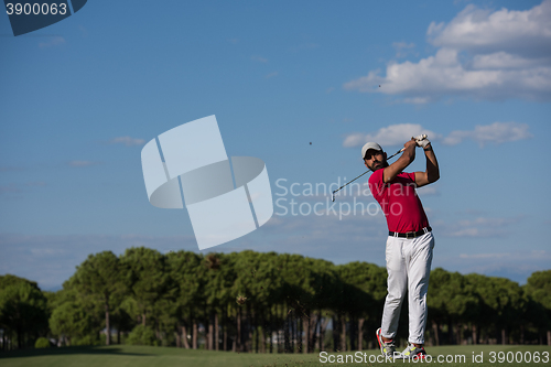 Image of golf player hitting long shot