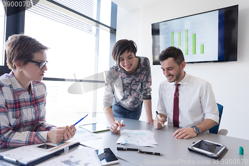 Image of young business people group on meeting at modern office