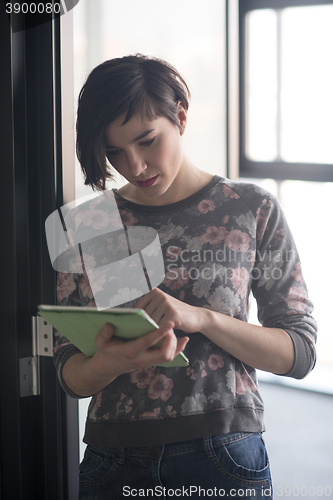 Image of business woman working on tablet