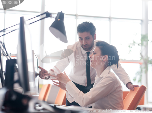 Image of business couple working together on project