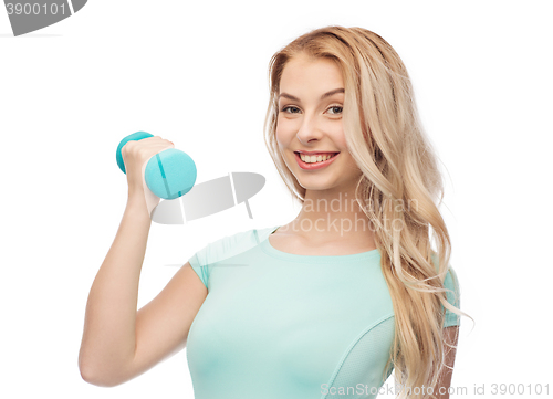 Image of smiling beautiful young sporty woman with dumbbell