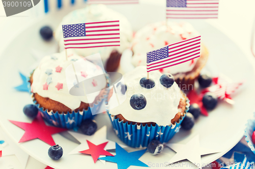 Image of cupcakes with american flags on independence day