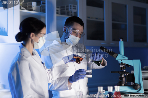 Image of close up of scientists making test in lab