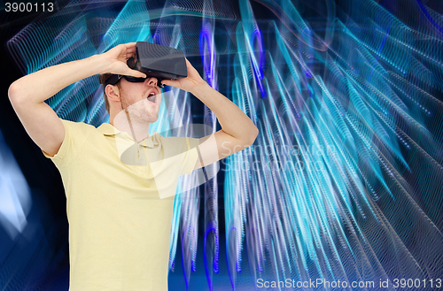 Image of happy man in virtual reality headset or 3d glasses