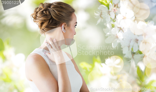 Image of close up of beautiful woman with ring and earring