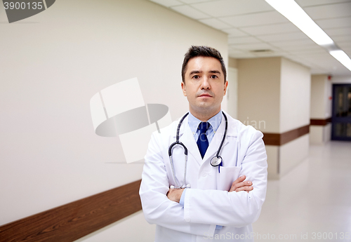 Image of doctor with stethoscope at hospital corridor